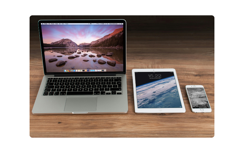 Laptop, tablet, and smartphone on a desk, highlighting the need for mobile eCommerce optimization.